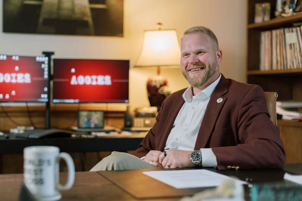 Adam Willman, FACHE, president and CEO, Goodall-Witcher Healthcare, Clifton, was presented the HOSPAC Star Award - Texas Hospital Association Smiling man in a burgundy blazer sits at a desk in an office, with two monitors glowing in the background.