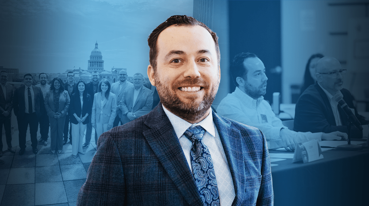 Smiling man in a checkered suit in the foreground with a group of professionals and a government dome in the background, blue-tinted image.