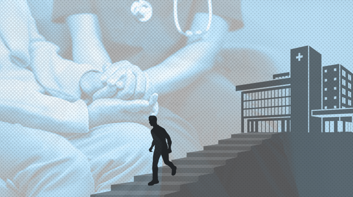 Silhouette of a person walking up stairs toward a hospital building with oversized medical imagery in the background.