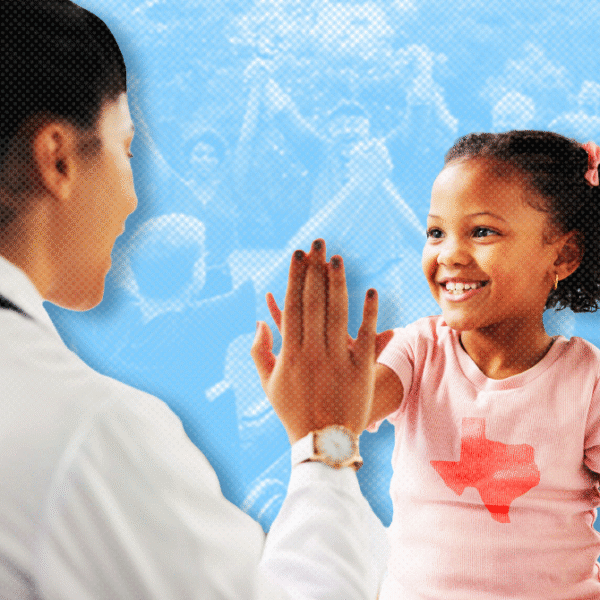 Pediatric clinician high-fiving a smiling girl during a checkup, blue background.