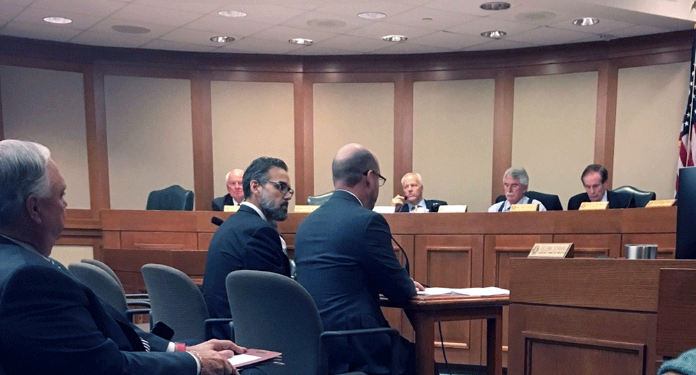 Holland testifying before the 88th Texas Legislature.