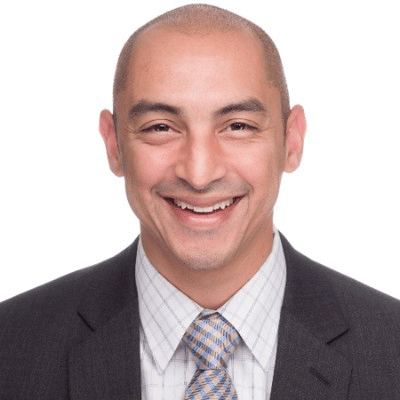 Jayson Laban - Texas Hospital Association Professional head-and-shoulders portrait of a smiling man in a dark suit and patterned tie.