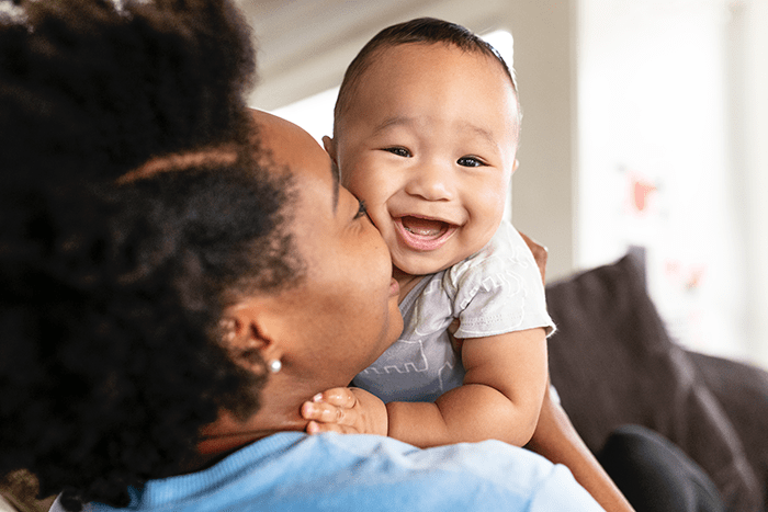 mom-and-baby_lg - Texas Hospital Association happy mother kissing her baby son